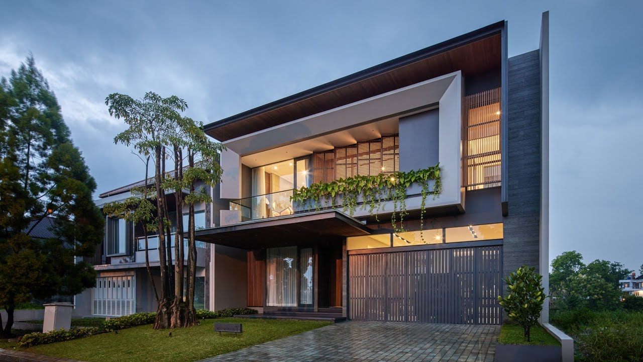 AJ HOUSE. Tropical Modern House by RAKTA STUDIO