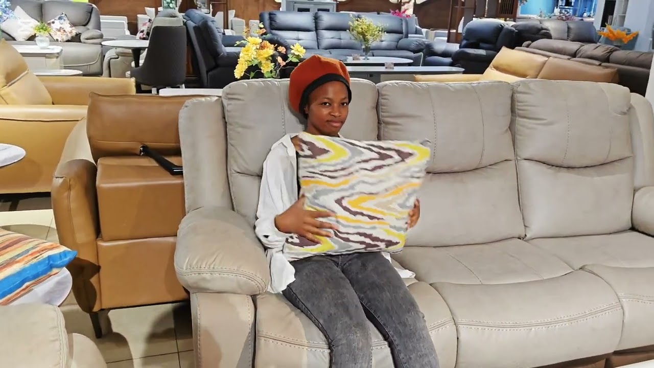 BLACK RECLINER SOFAS, BROWN DINING TABLES, WHITE COFFEE TABLES AND MOREEE