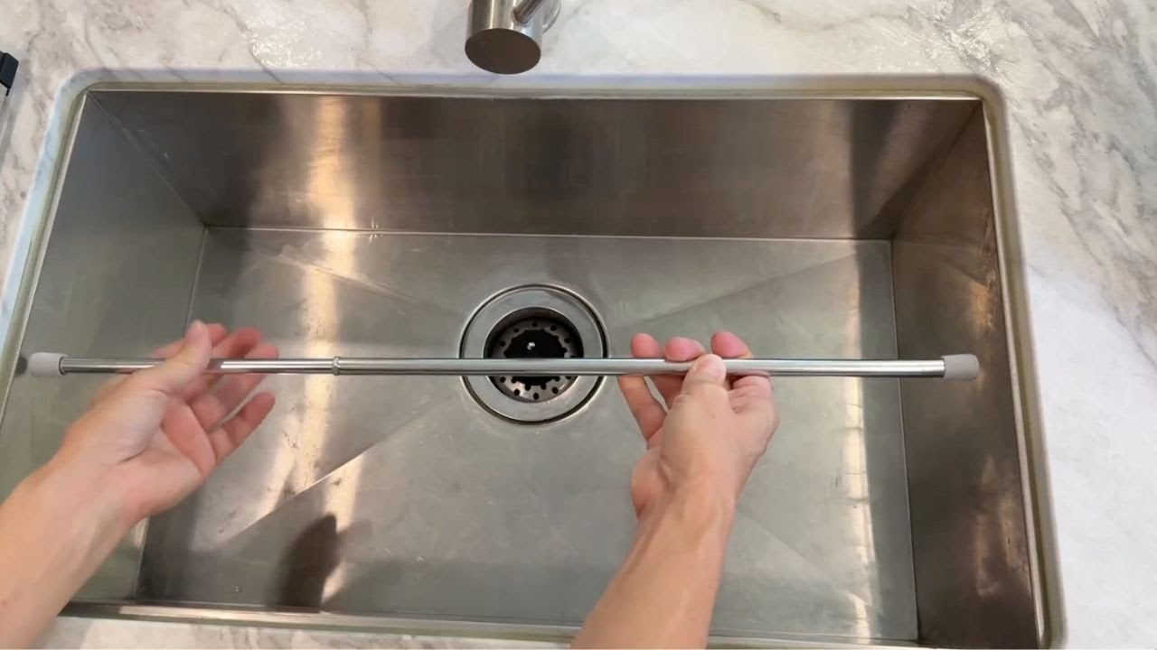 Stick a tension rod in your kitchen sink... (This is BRILLIANT!)