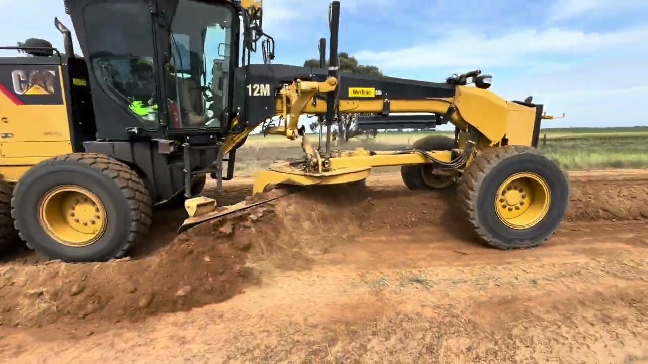 Heavy grading with gravel retrieval using a Padfoot roller. Material was a little dry.