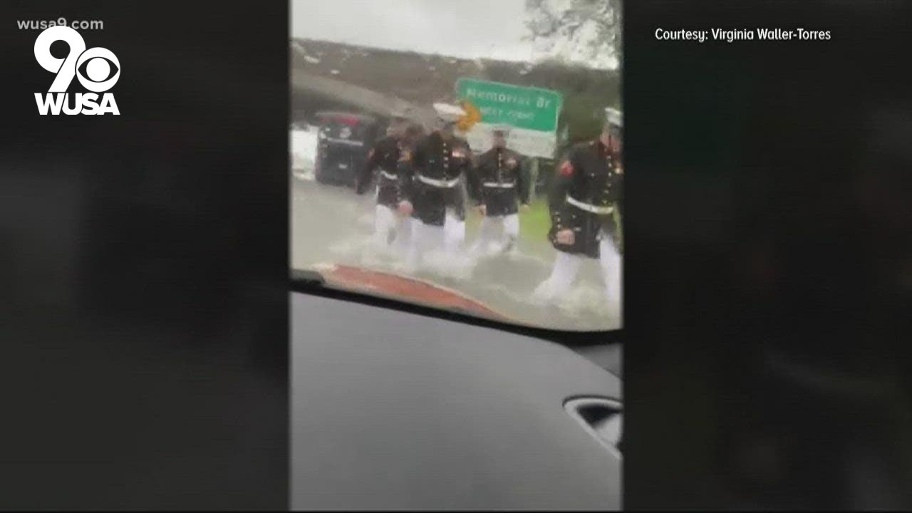 Marines help stranded woman after car becomes stuck in floodwater
