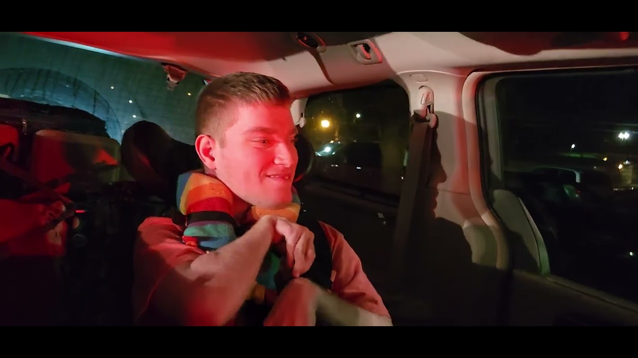 Sam in the van on the way to Disney getting some taco bell for dinner.