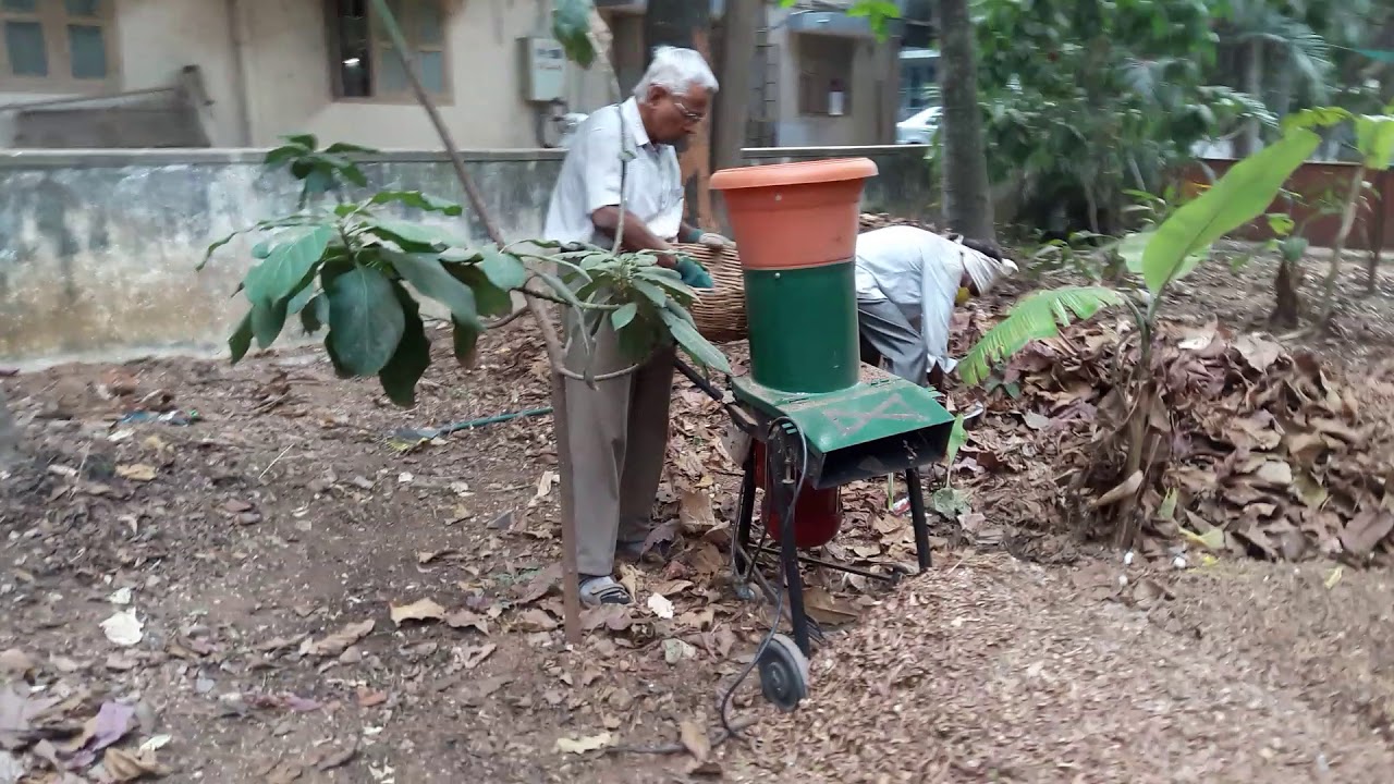 Leaf shredding in our garden using Chandra Shekar' s  self developed 2 hp Shredding Machine