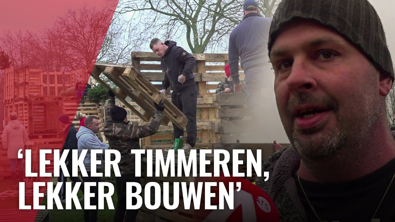 Floradorpers druk met opbouw vreugdevuur voor jaarwisseling