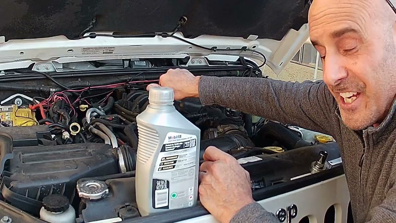 VID 1 changing oil 2013 Jeep Wrangler Rubicon with Baxter oil filter adapter