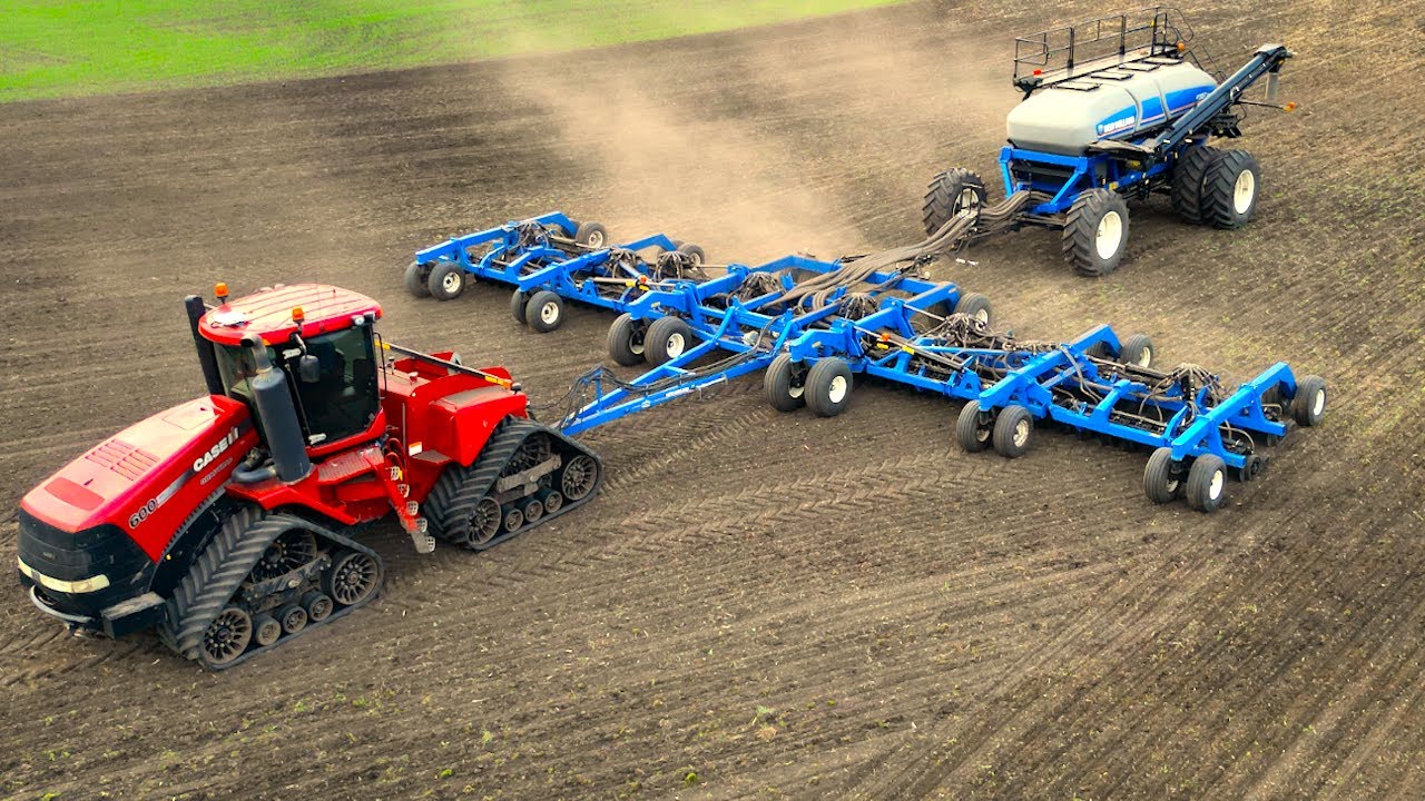 Case IH quatrac tractor pulling New Holland air seeder & air cart  Drone video