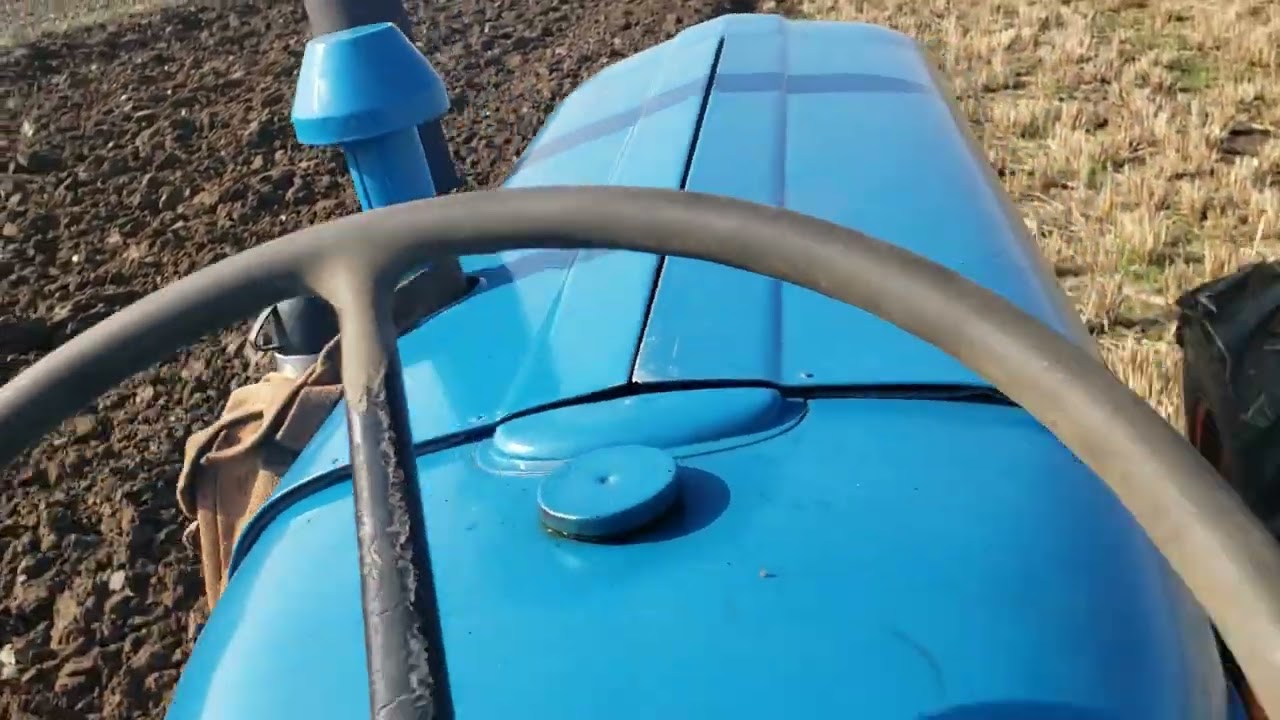 fordson roadless power major pulling two different types of plough
