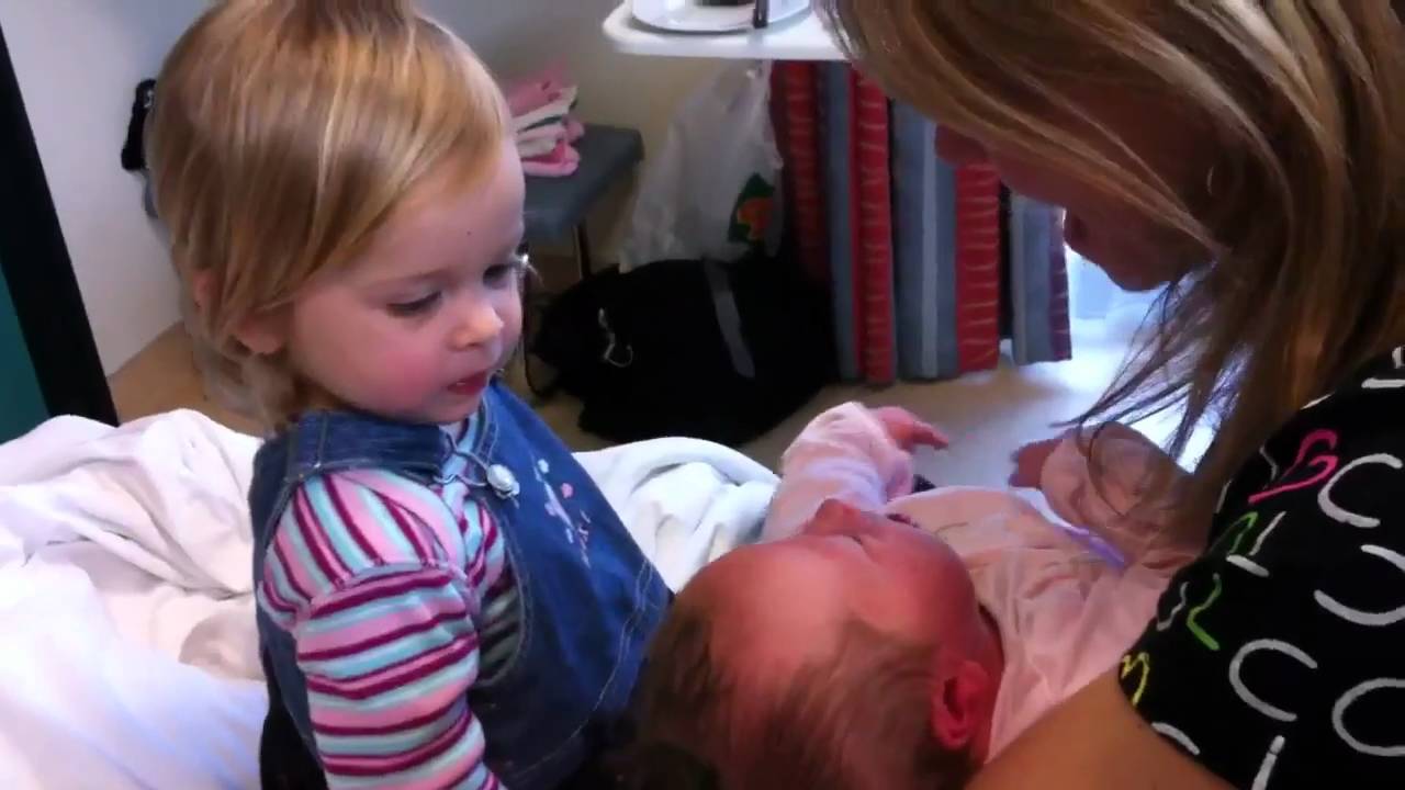 Little girl meets baby sister 1st time ever