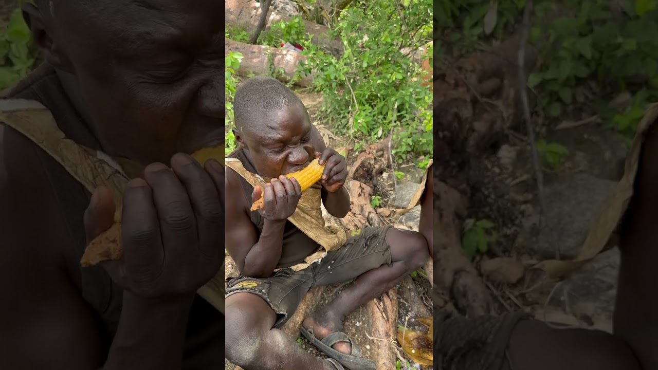 Hadzabe Tribe bushmen Chabba try hot corn first time in the bush 🥰