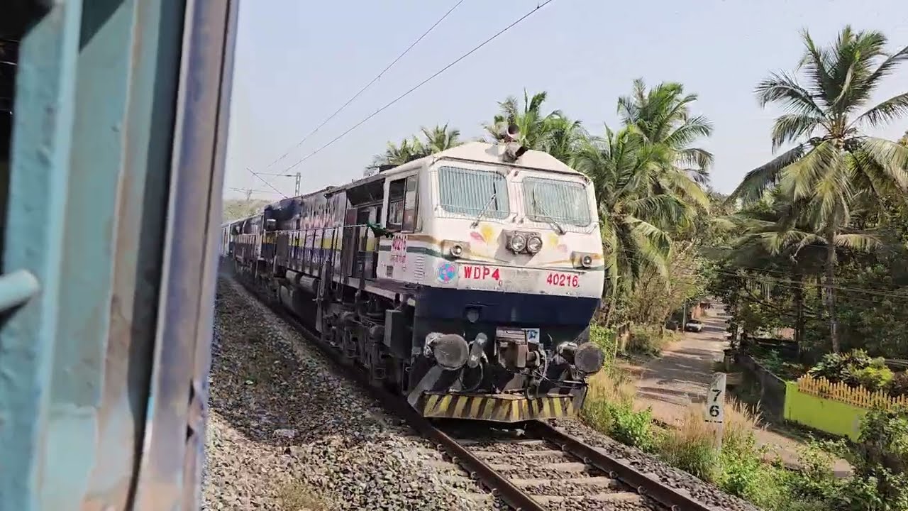 18047 Amaravati express crossing my 56964 Vasco Kulem DEMU before Chandor railway station. 