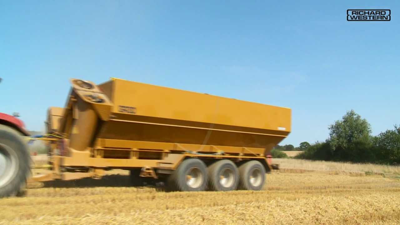 Western GR30 Grain Chasers working with 3 Claas 770 Combines
