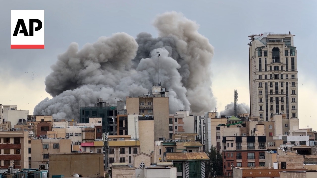 AP video shows smoke rising in Tehran after several US-Israeli strikes hit areas of Iran's capital