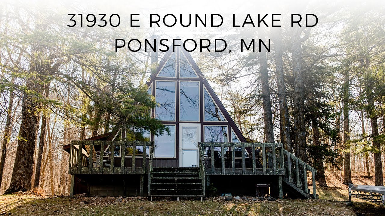 31930 East Round Lake Rd - Awesome Package with A-frame, guest cabin, and garage on 210' of frontage