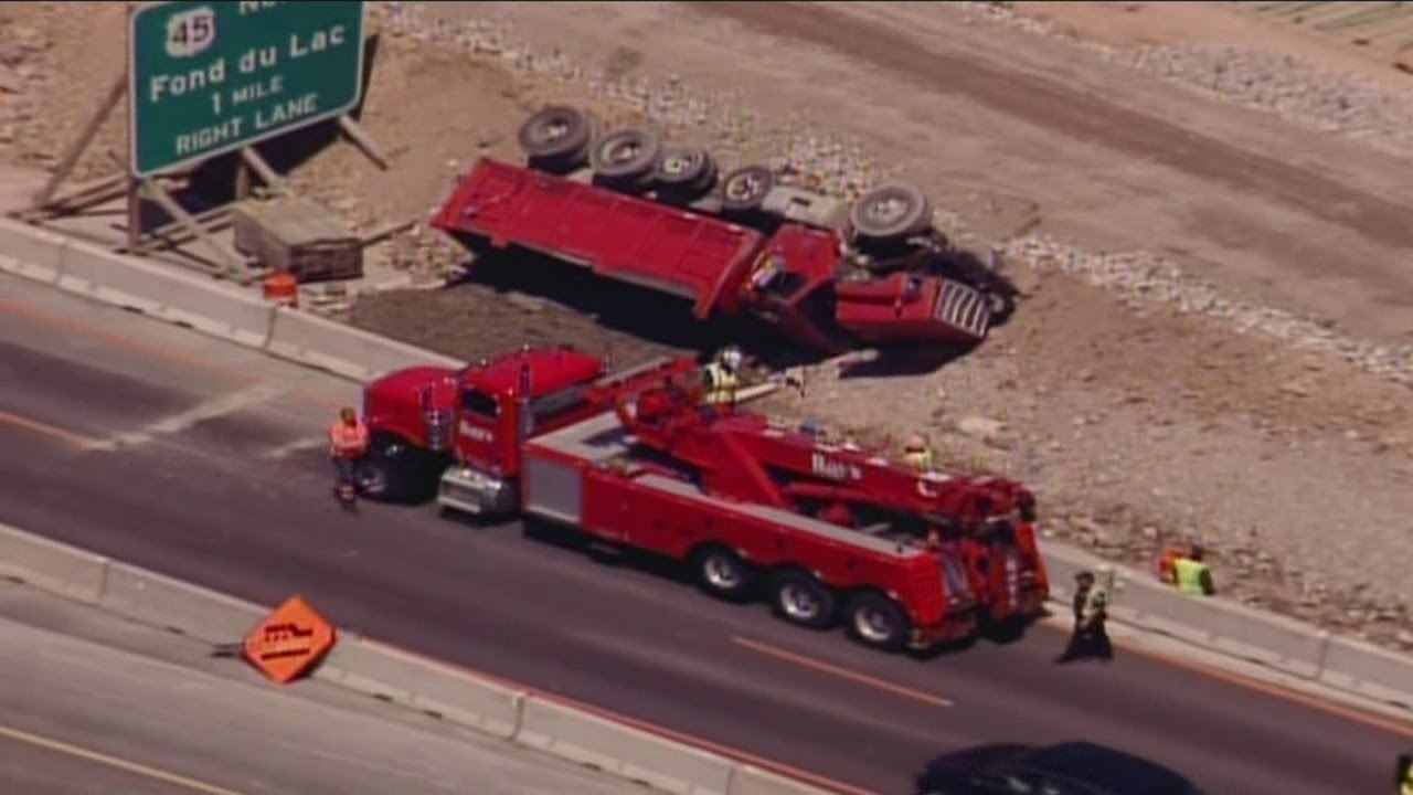 Surveillance video shows dump truck tip over in Zoo Interchange construction zone