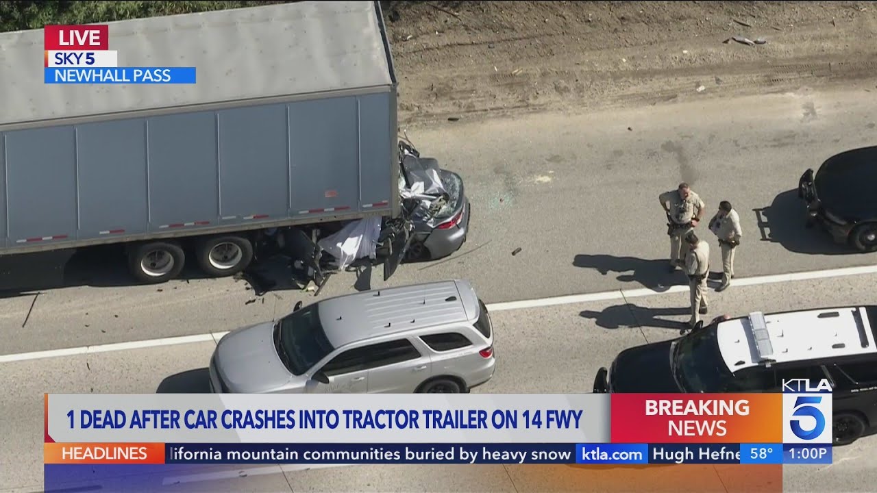 1 dead after car crashes into big rig on 14 Freeway