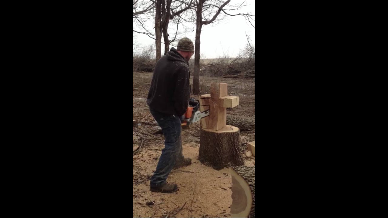 Carving a cross in a stump