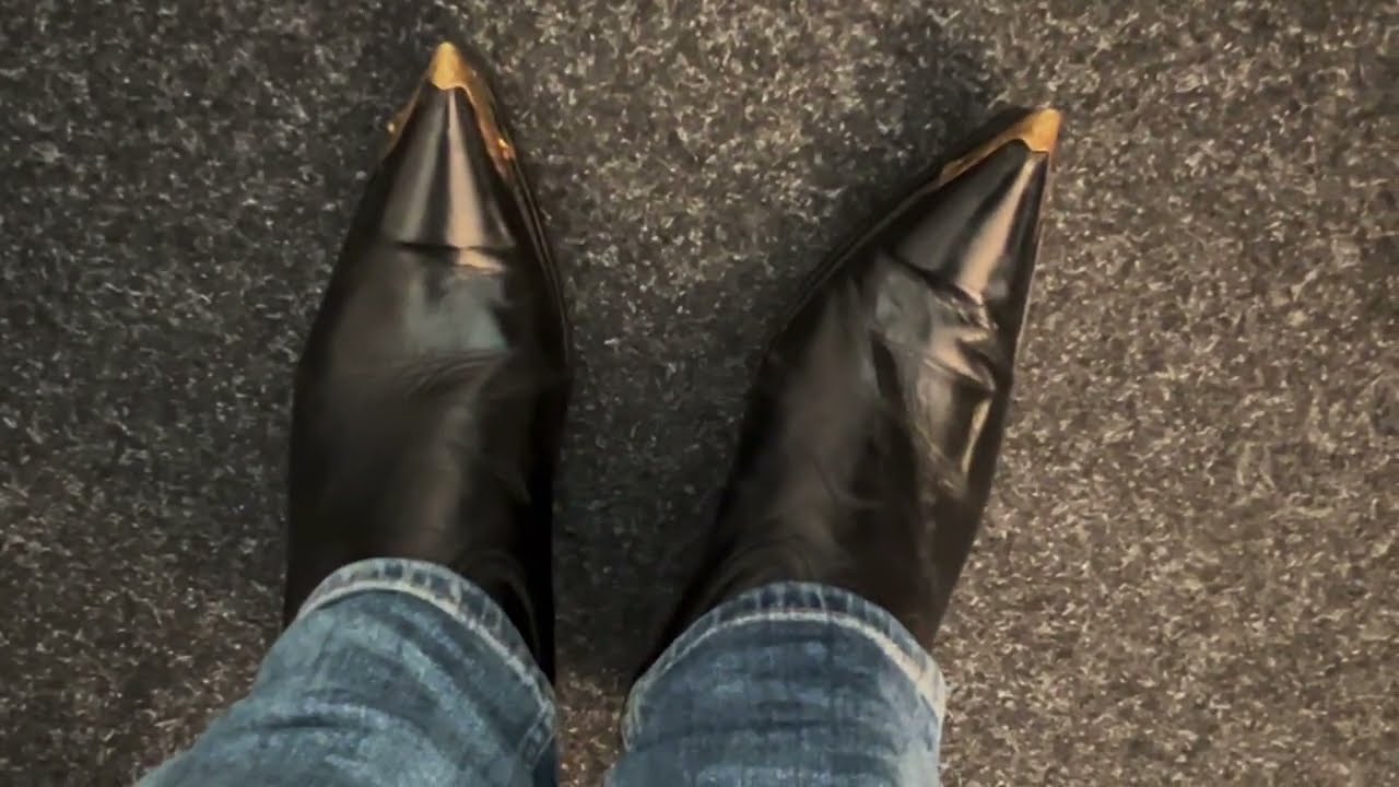 black Genio cowboy boots with golden tips