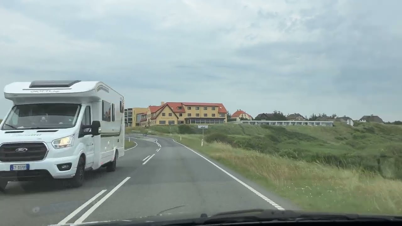 Driving into Nymindegab village, through pastoral landscape with sand dunes