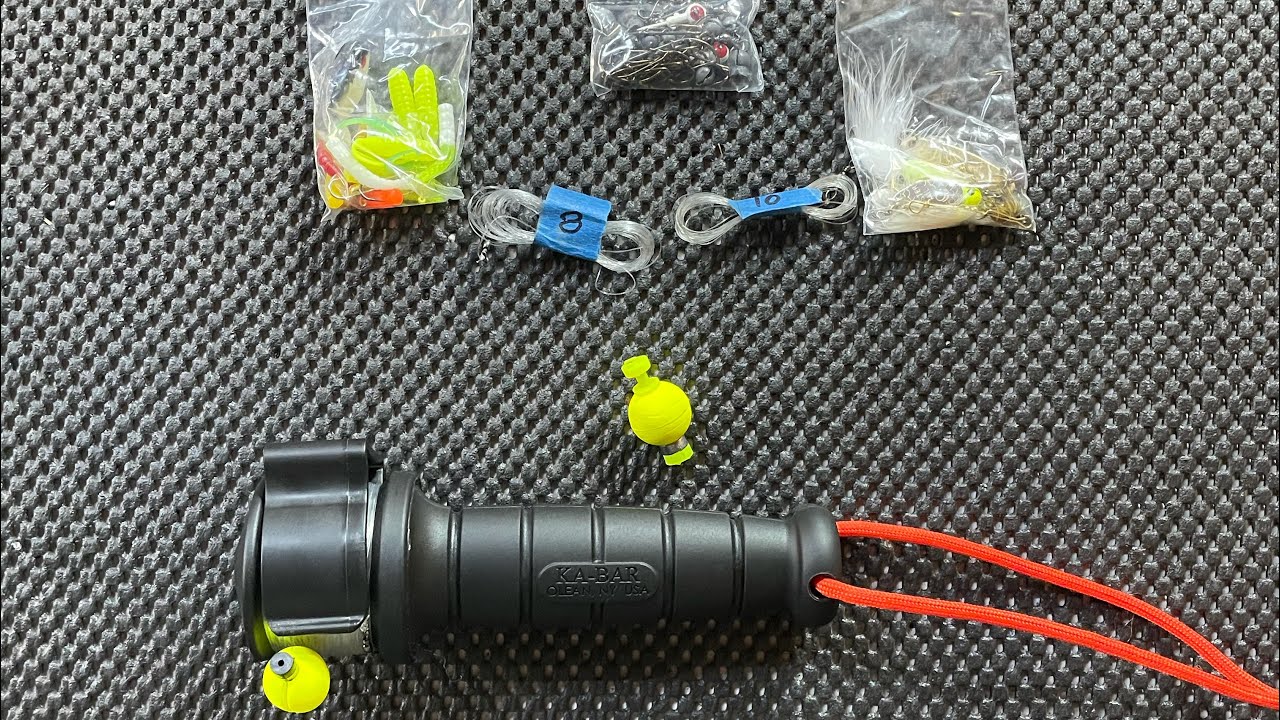 Minimalist fishing kit.  Ka-bar hand reel