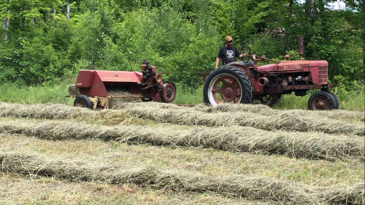 Old school haying with farmall H and new holland equipment
