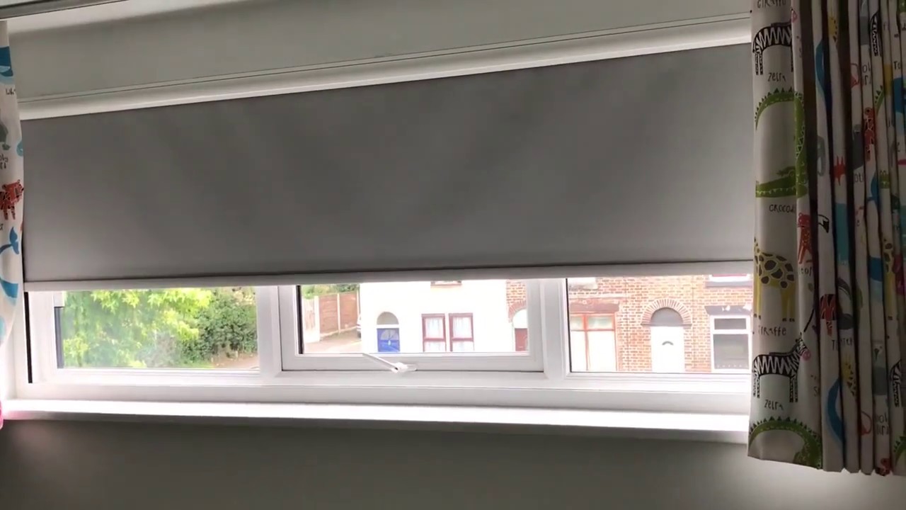 Motorised blackout roller blind in a cassette for total darkness.
