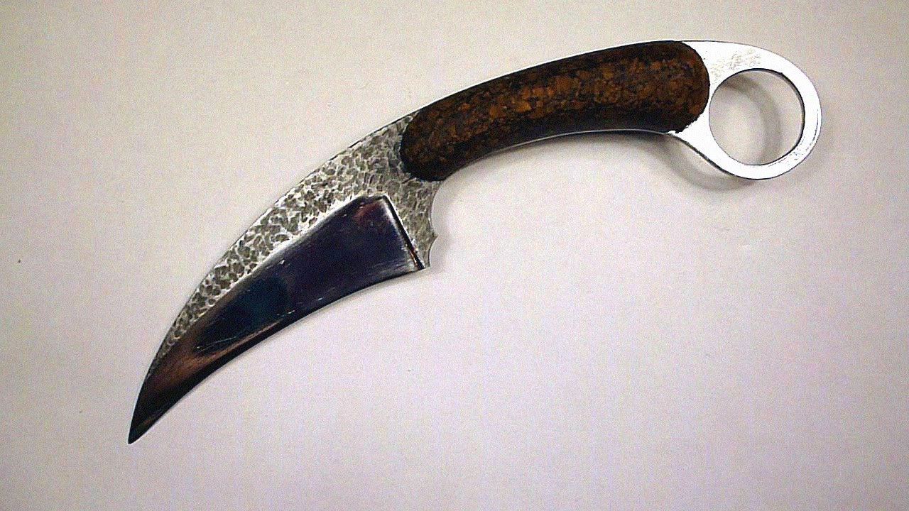 Керамбит из пилы, микарта из пробки.