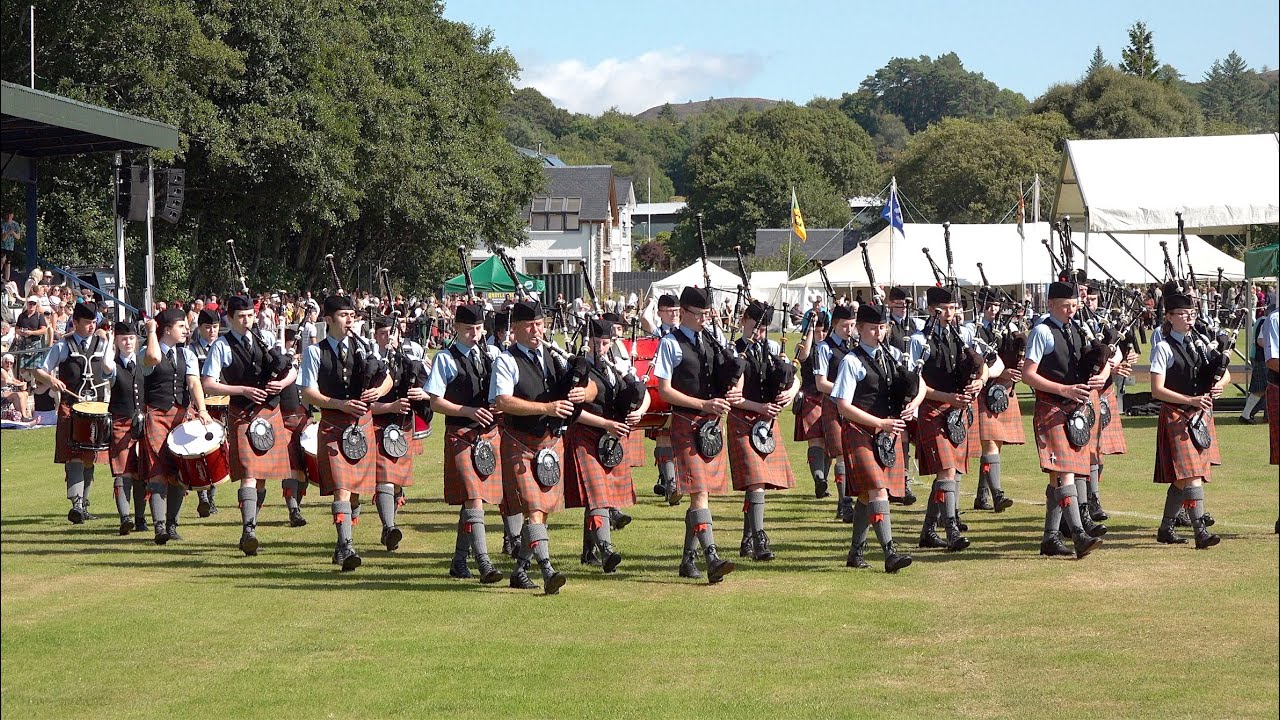 Oban High School Pipe Band field march during 2021 Argyllshire Gathering Oban Highland Games
