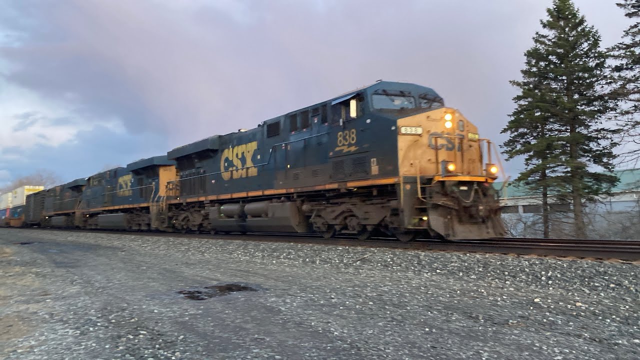 A three-locomotive priority train hauls it west