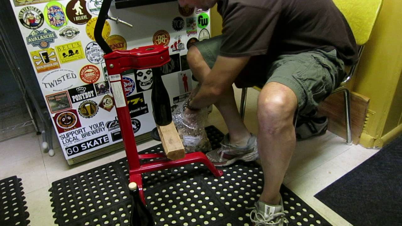 Bottling homebrew in Belgian bottles with corks and cages.