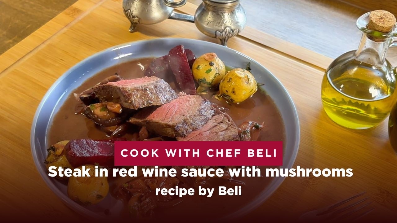 Steak in red wine sauce with mushrooms