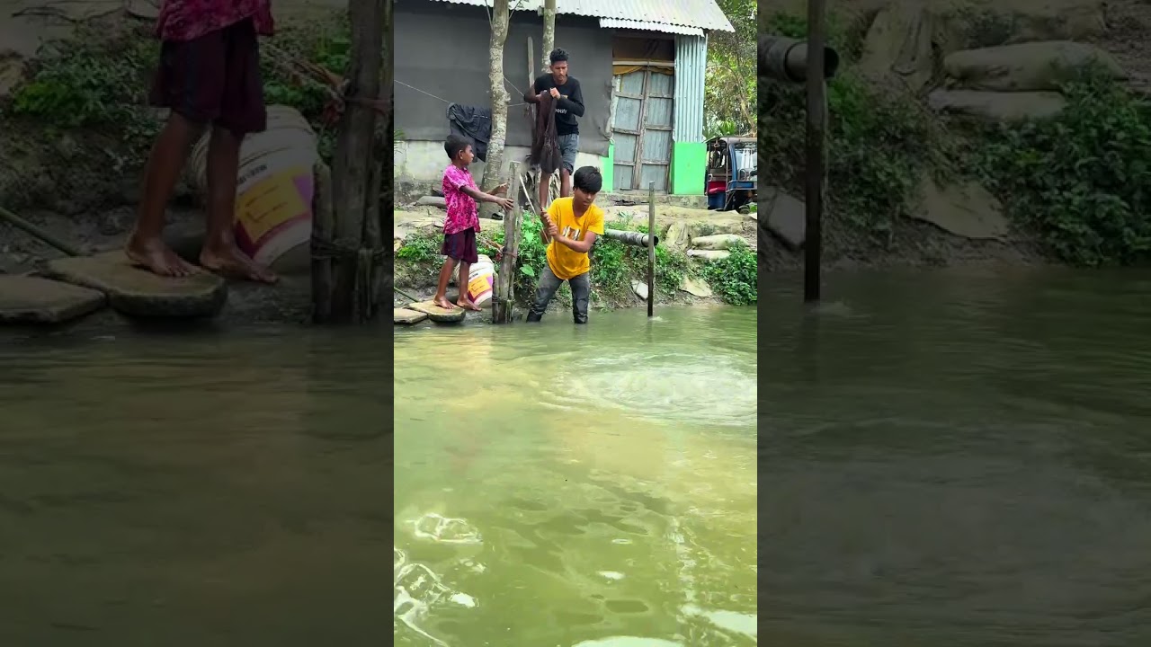 Little boy catch fish with small hook.
