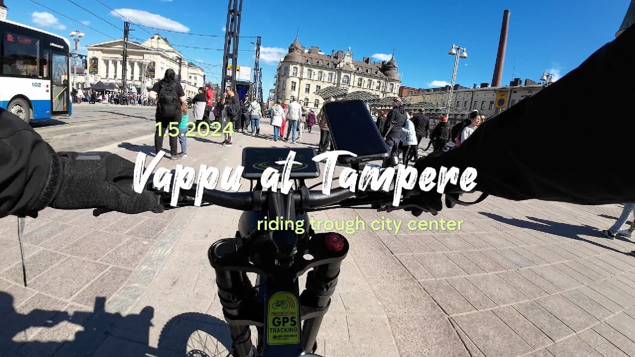 Riding e-bike through Tampere city center at Vappu...