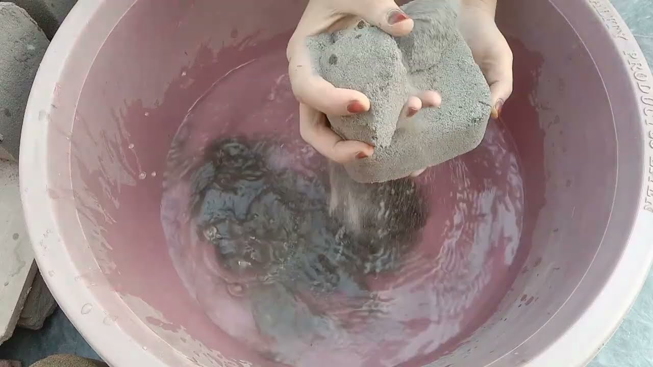 Old video pure sand cement with charcoal powder water crumbling in tab soft dusty texture 