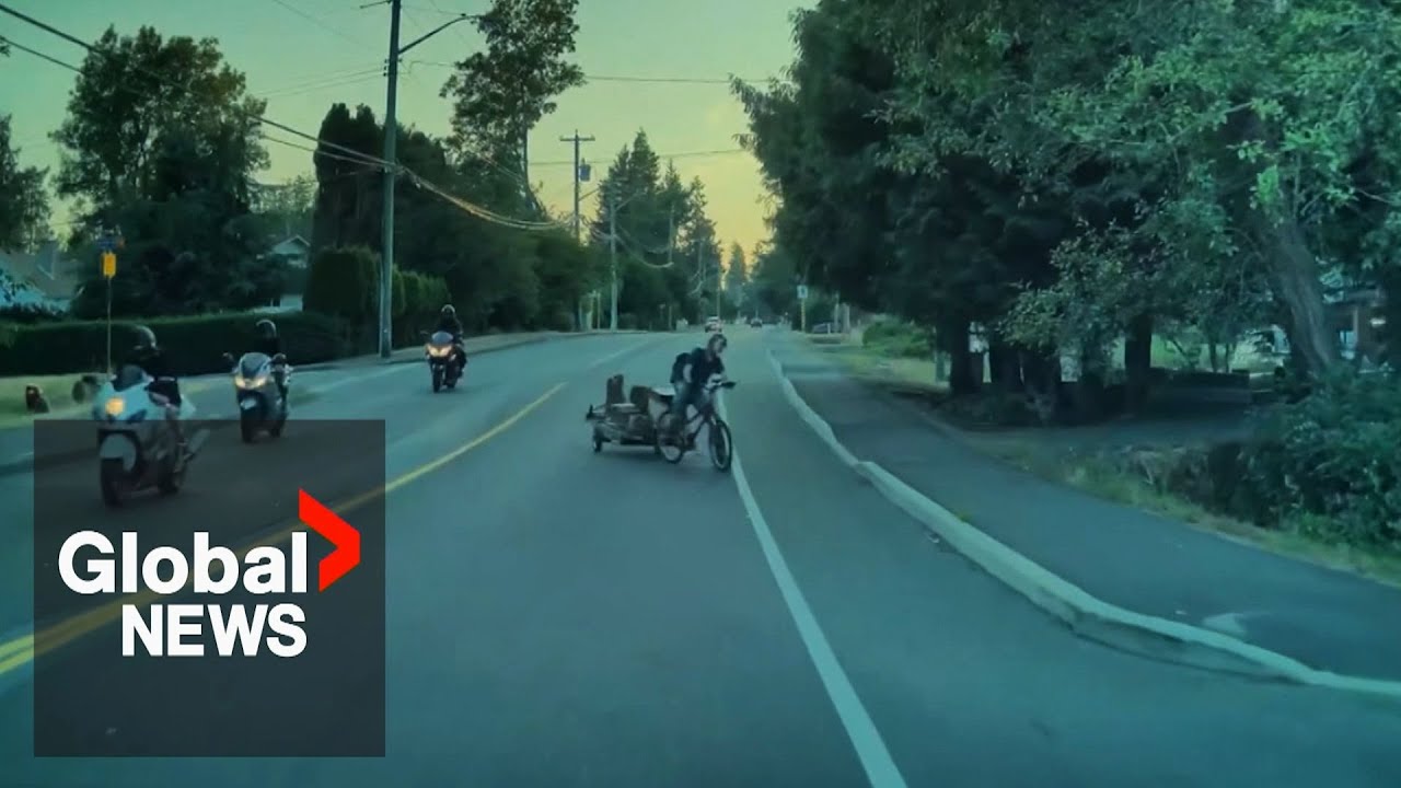 Caught on camera: BC cyclist says motorcyclist pushed him, causing crash