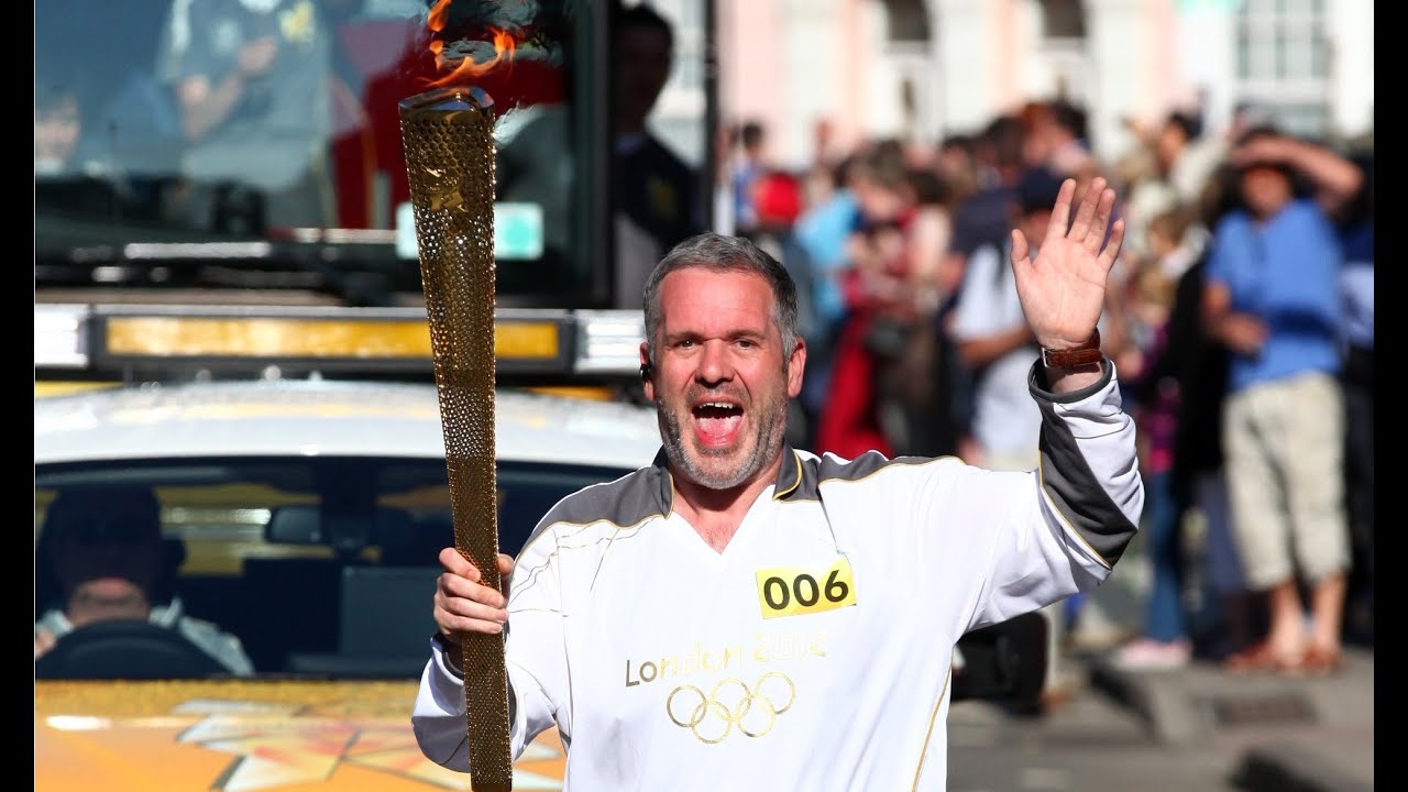 Chris Moyles sneaks out live on-air to carry the Olympic Torch!