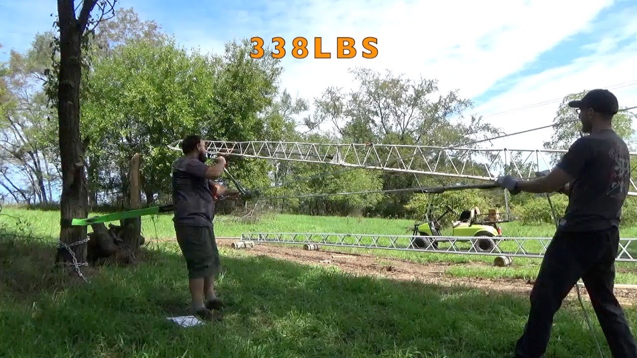 Lifting a 60ft tower with a hand crank.