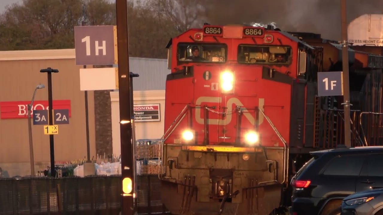 CN 8864 Westbound Passes Cobourg VIA Station