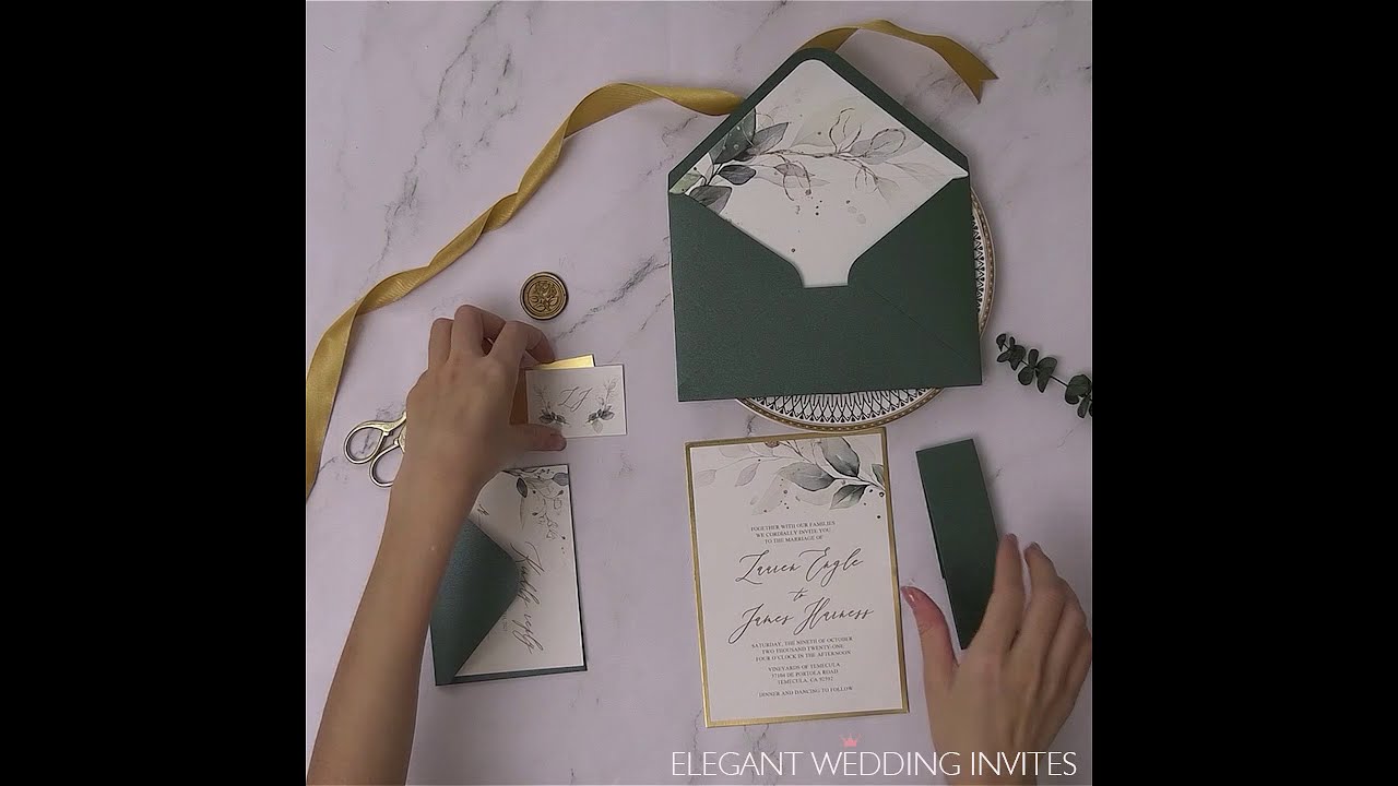 DIY greenery wedding invitation set with emerald green envelope and belly band