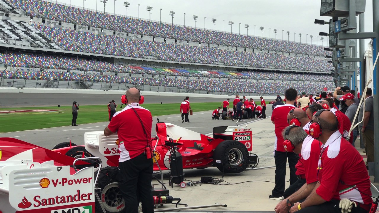 Ferrari F1 cars leaving Pits & Lapping Start Finish at Daytona International Speedway