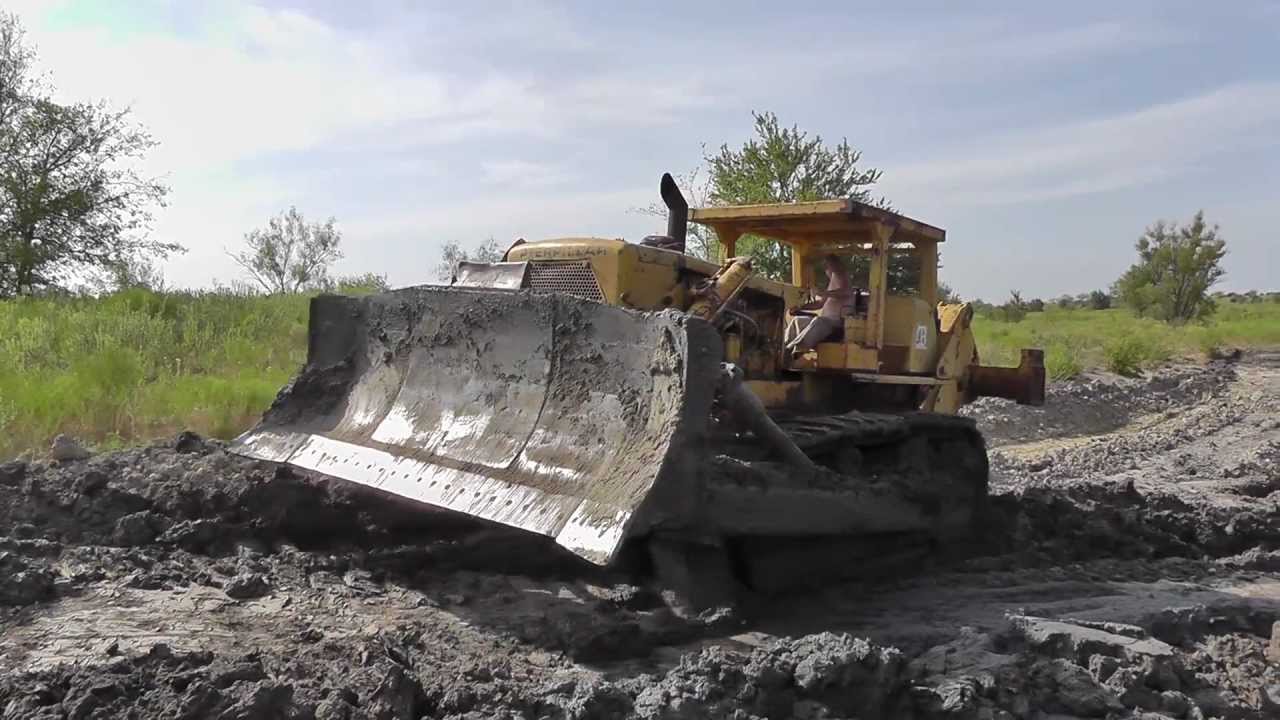 CAT D9G ACTION POND CLEANING