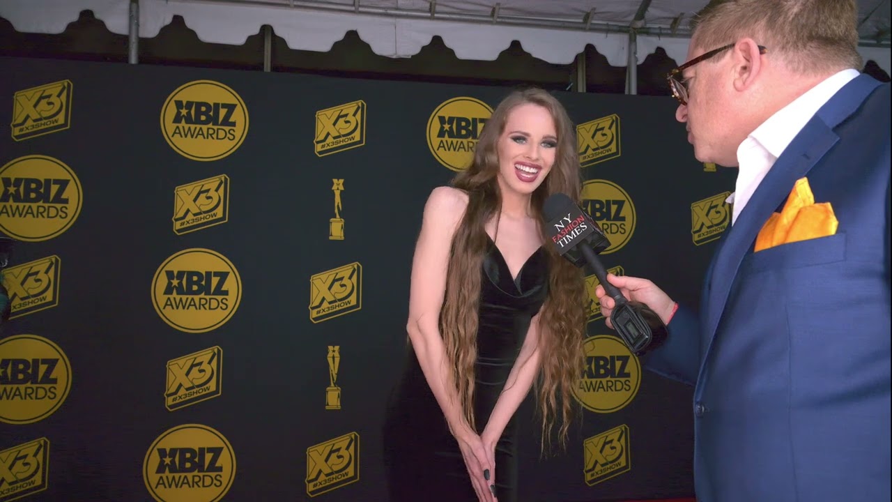 Jillian Janson wears a velvet dress at the Xbiz Awards Red Carpet in Hollywood, CA