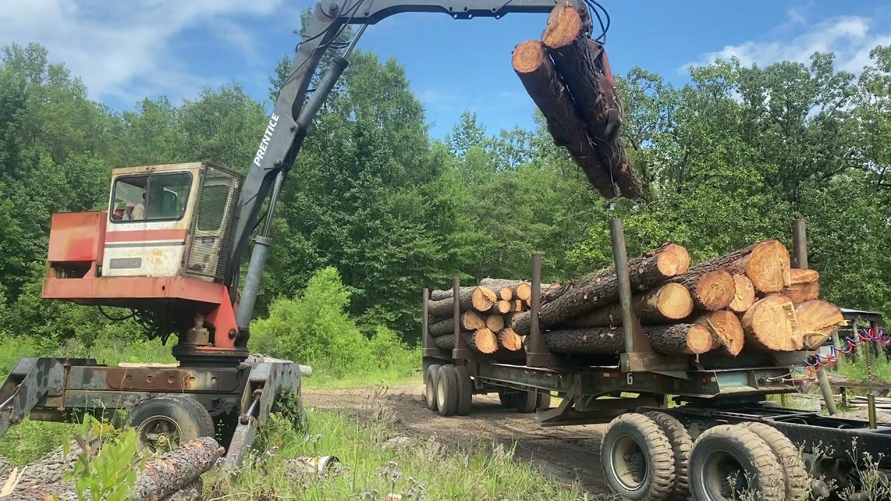 Unloading logs at the sawmill!!!