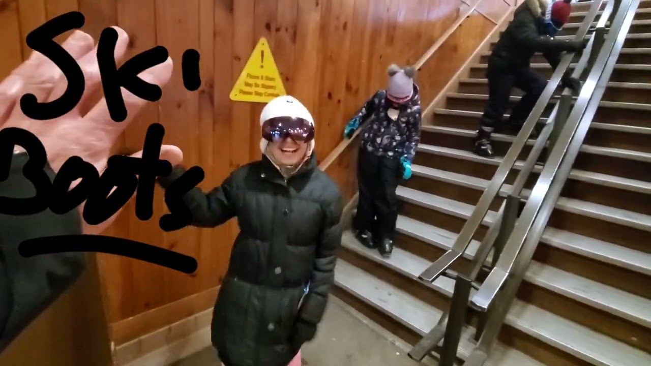 Walking down the steps in ski boots