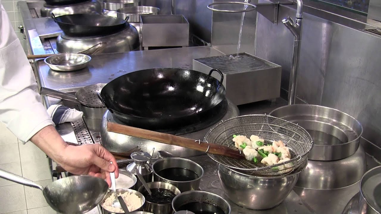 Michelin Paul Lau makes a dish at floor 103 in HK