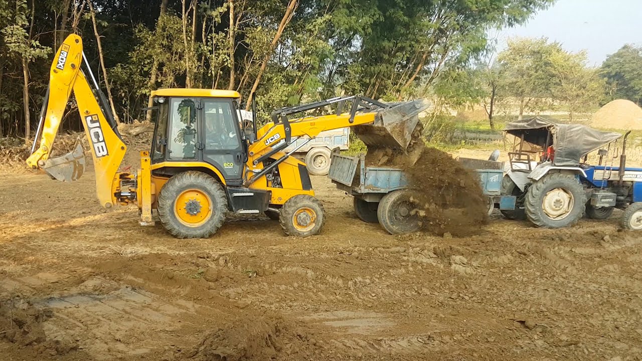 JCB Machine Collecting Mud and Loading in Tractor - JCB Backhoe Leveling Ground
