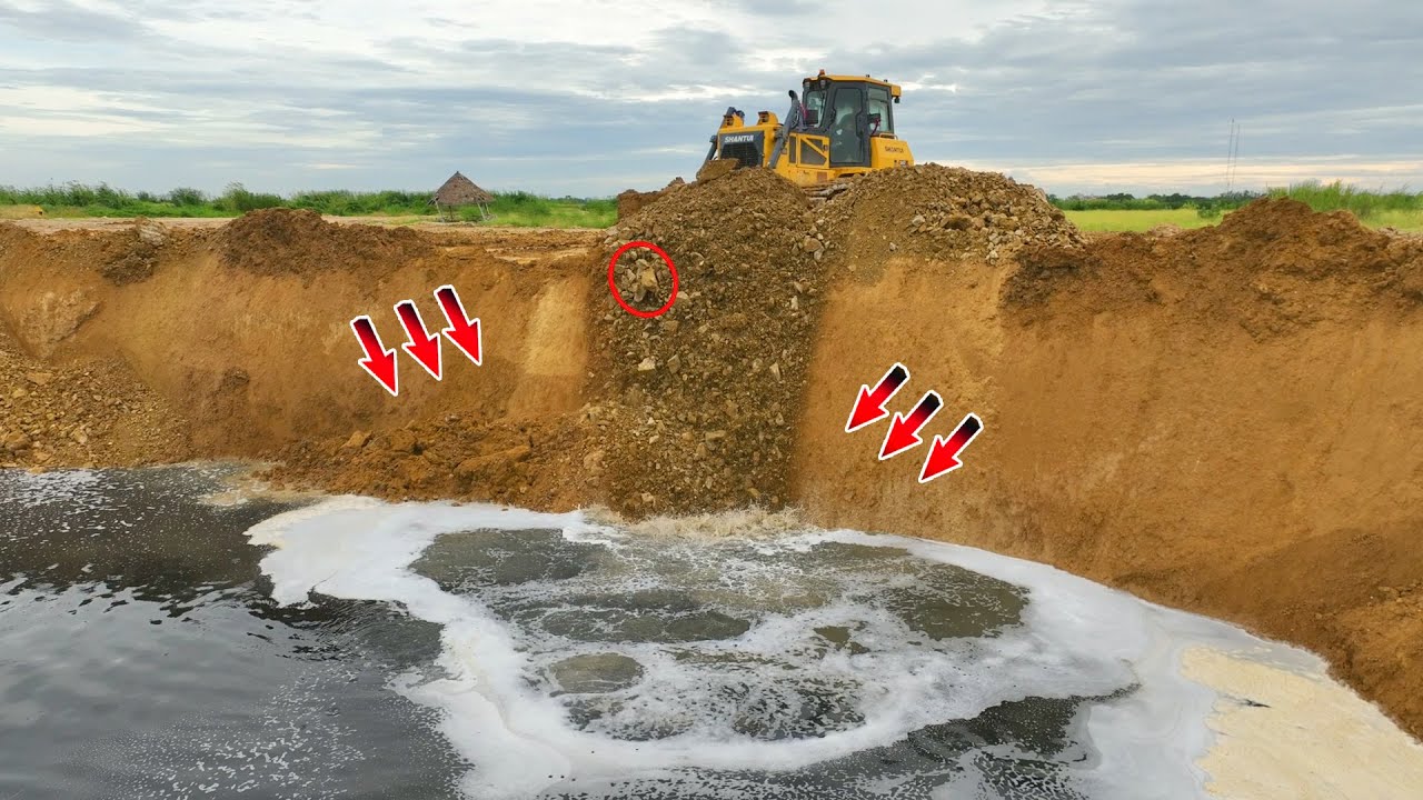 Good, job Dozer SHANTUI DH17 C2 pushes soil to build a NEW road next to the shore of Sen Deep Lake