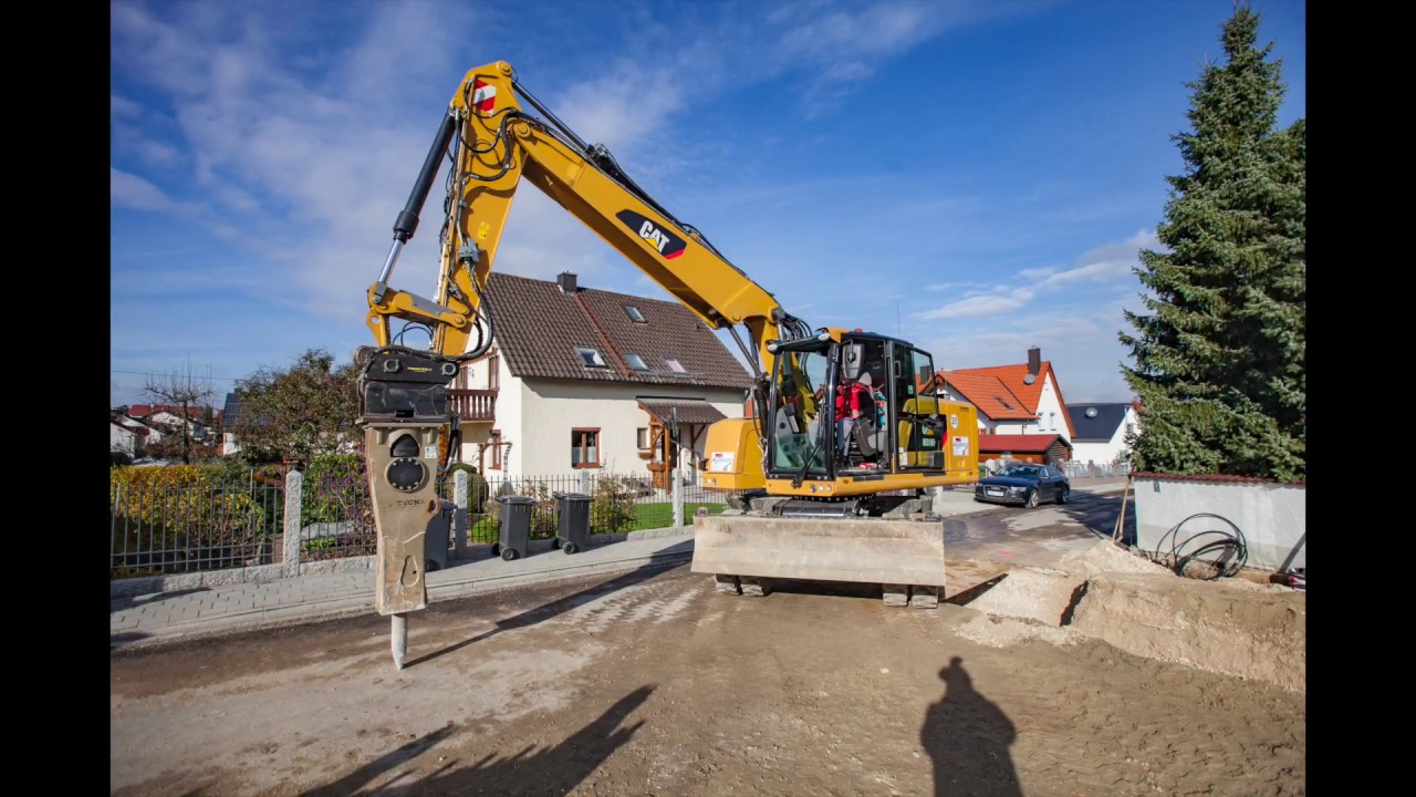 Cat M318F with engcon fully hydraulic Quick Coupler