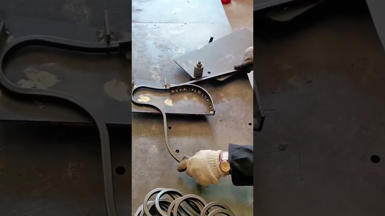 Precision metal bending process for creating uniform decorative steel curves using a custom forming