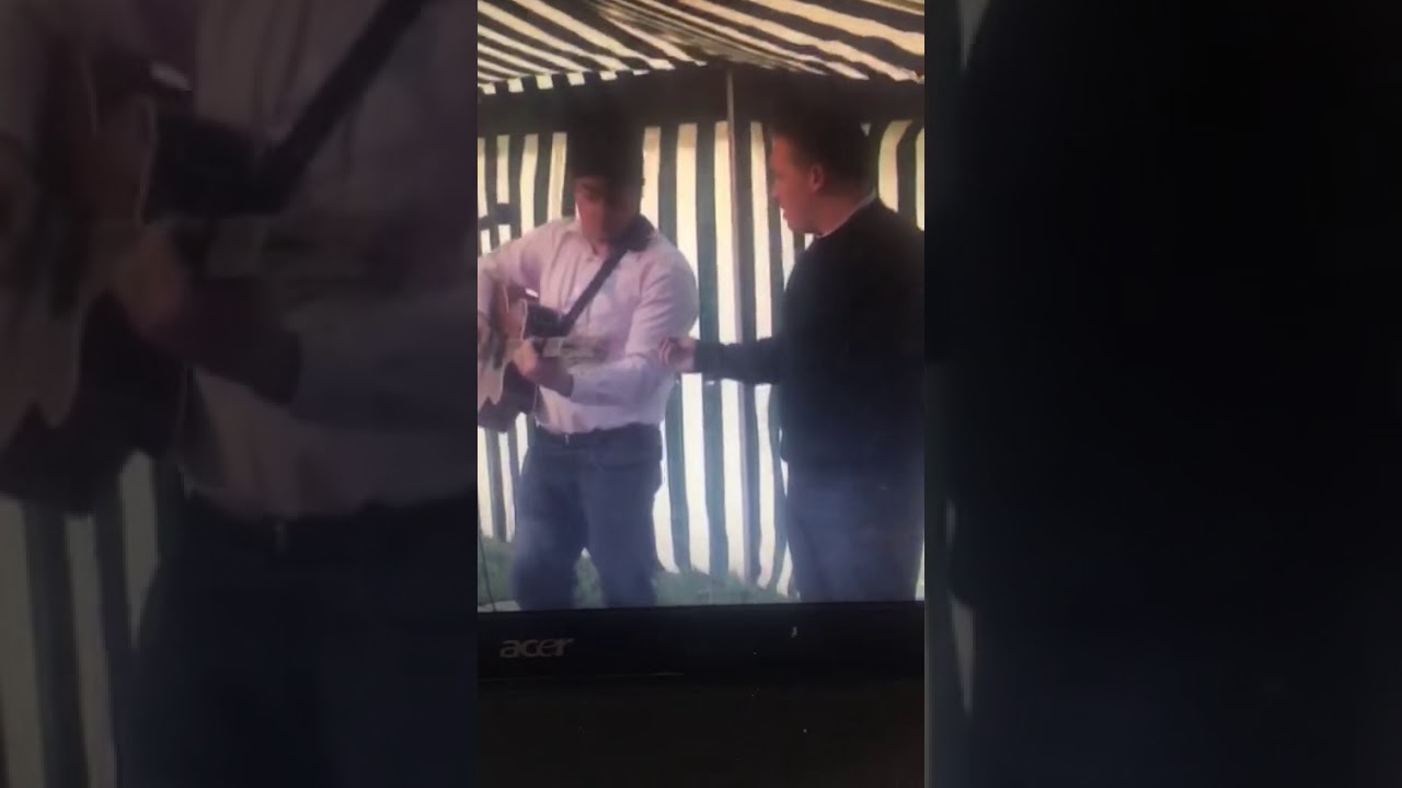 Ned Doherty singing at a mission in Ireland