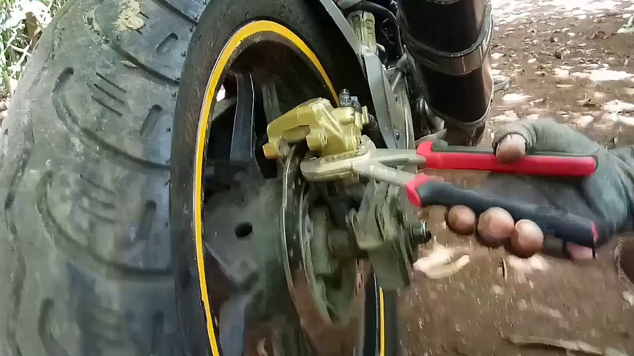 How to change rear brake pad for Rs200 pulsar